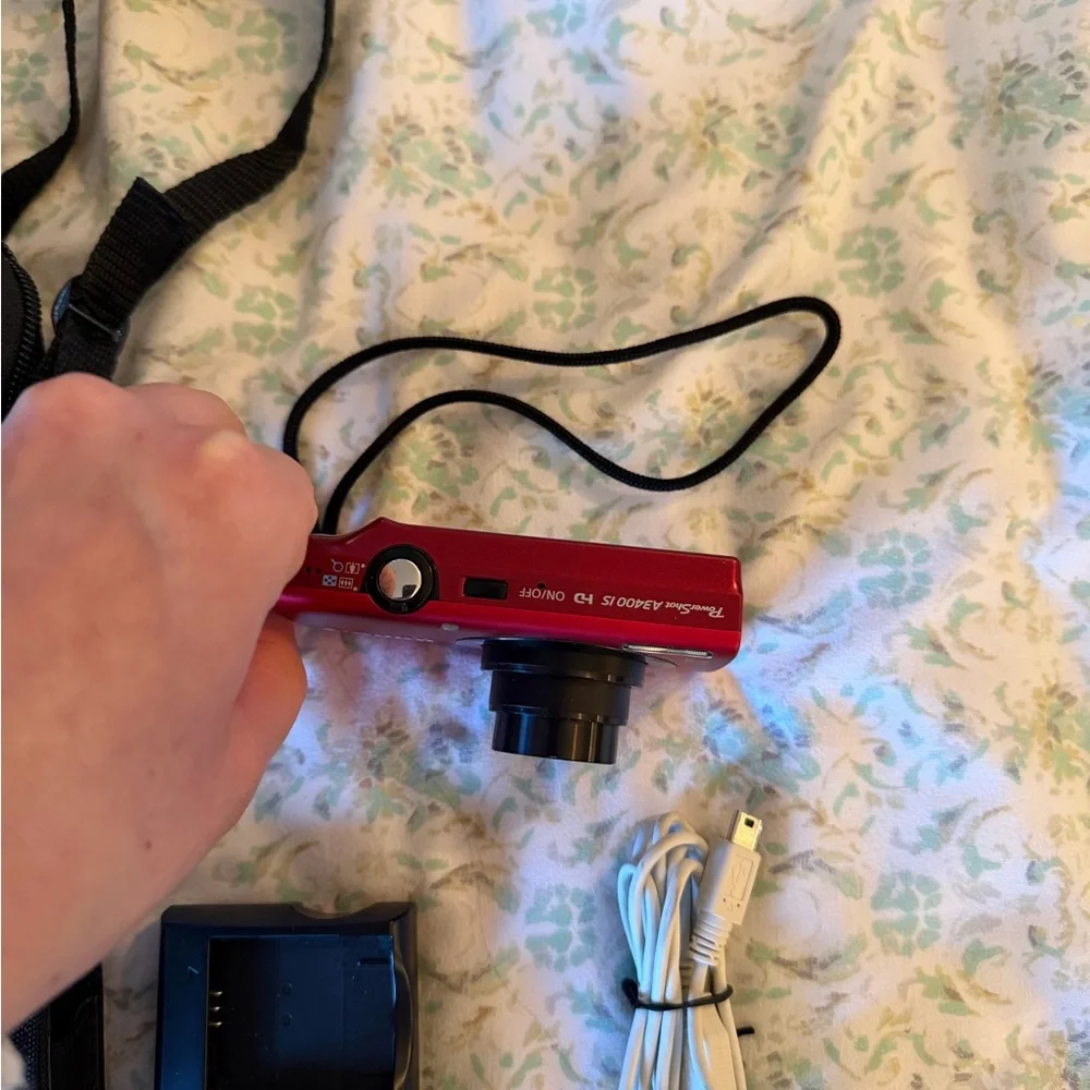 Canon Red Digital Camera with Black Accessories